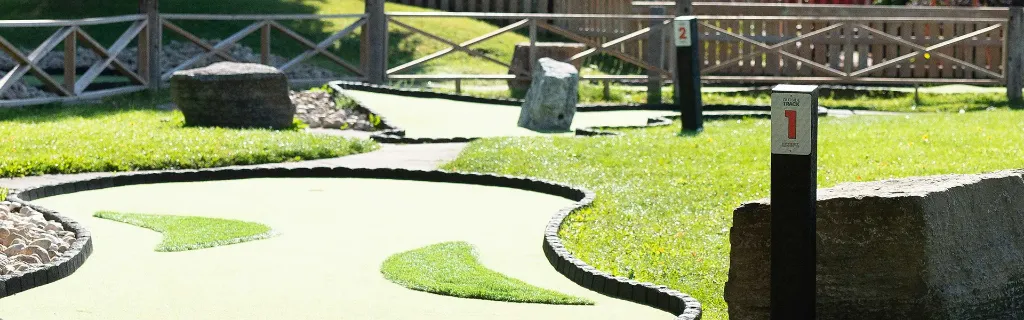 A mini golf hole at Market Sports with obstacles and elevation changes.
